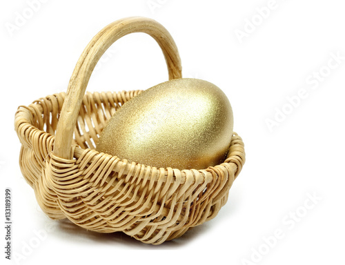 Easter Gold egg  in basket cart. White background isolated.