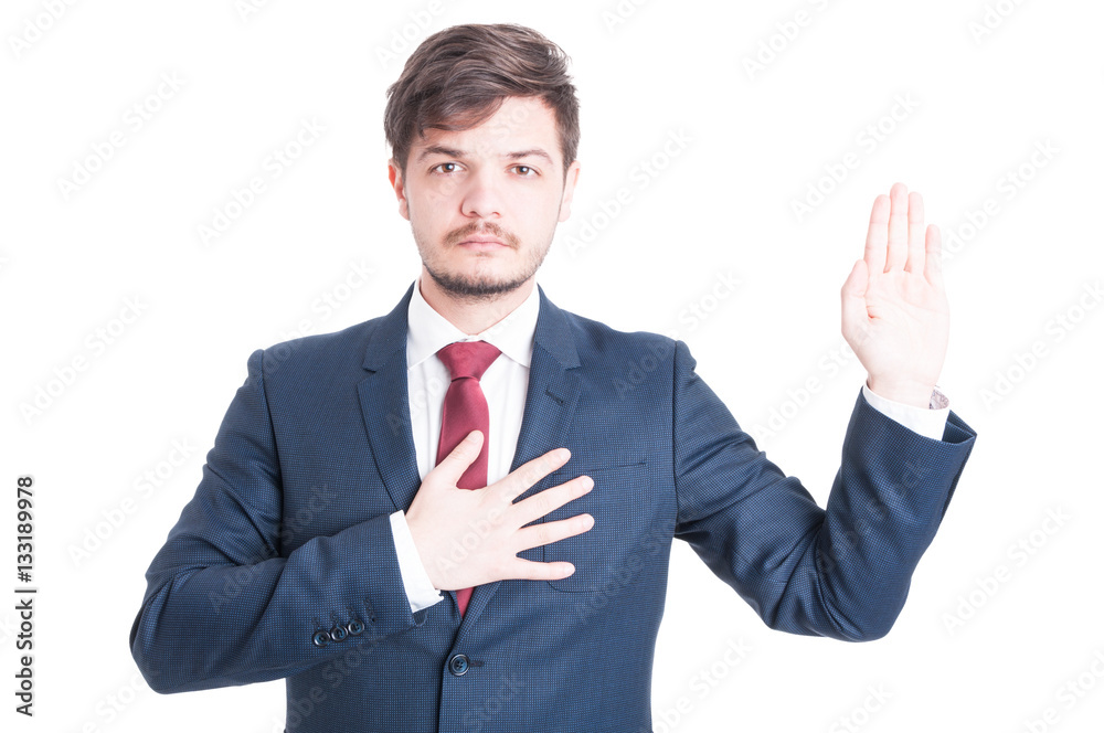 Business man or politician standing raising hand taking oath Business man or politician standing raising hand taking oath
