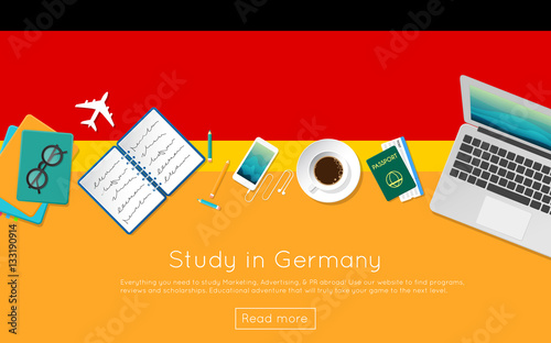 Study in Germany concept for your web banner or print materials. Top view of a laptop, books and coffee cup on national flag. Flat style study abroad website header.