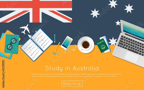 Study in Australia concept for your web banner or print materials. Top view of a laptop, books and coffee cup on national flag. Flat style study abroad website header.