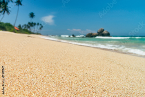 Fototapeta Naklejka Na Ścianę i Meble -  Sunny beach near Koggala - Sri Lanka. Waves of clear water and warm sand 