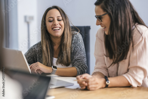 Young team of coworkers making great work discussion in modern c