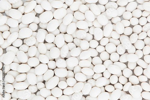White kidney beans closeup top view background. Healthy protein food.