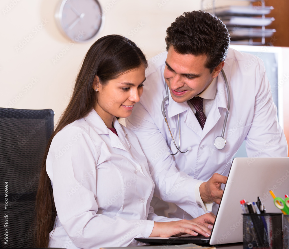 Fototapeta premium Intern and medical tutor at clinic.