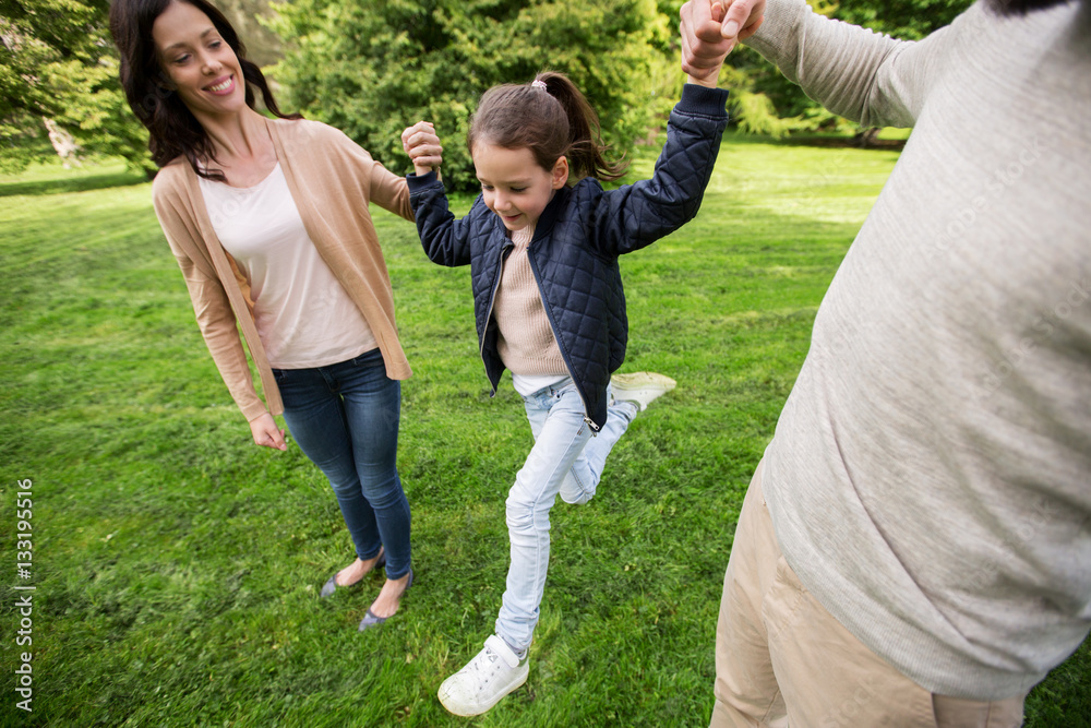 Fototapeta premium happy family walking in summer park and having fun
