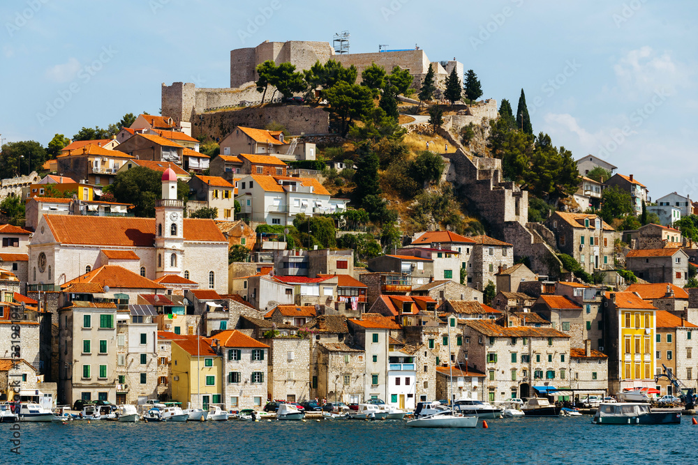 day view of the historical part with old houses and St. Michael's fortress in Sibenik, Croatia.