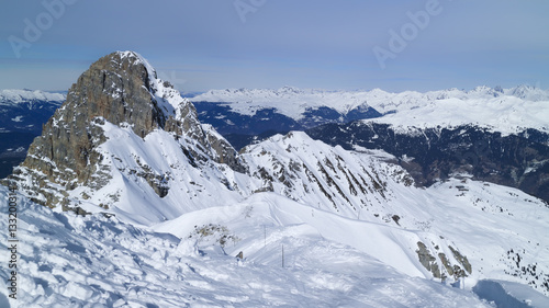 Alpine snowy peaks panorama  skiing piste on an edge of a rock  Meribel resort  3 Valleys  Alps  France