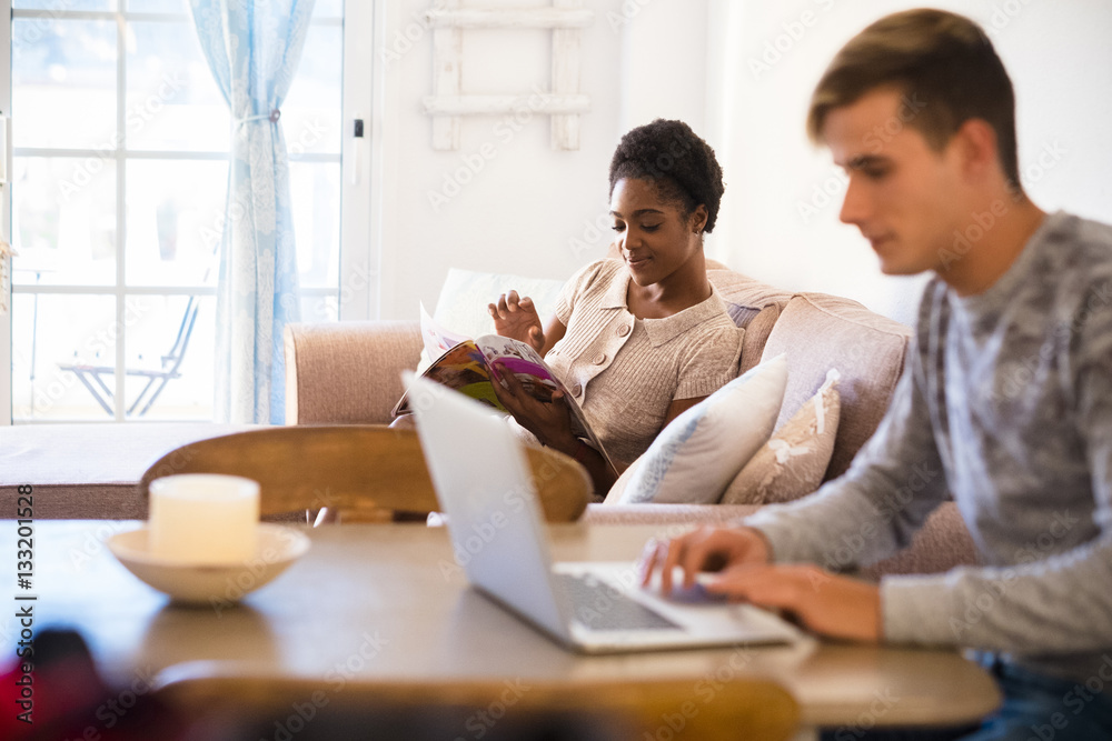 Young couple relaxing in the living room