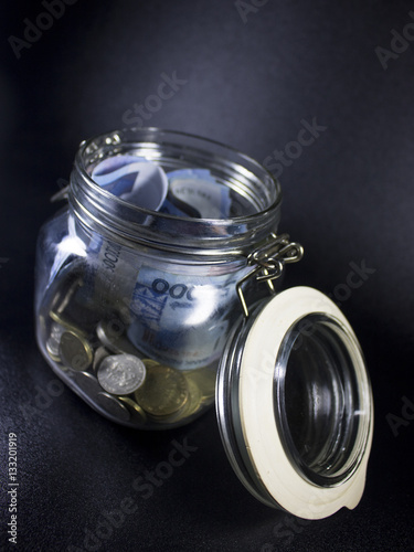 travel money glass jar world vacation planning currency