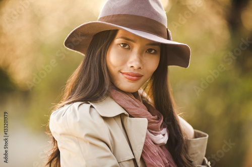 Elegant Asian Woman Outdoors © LStockStudio