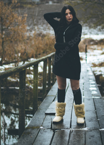 Girl on the bridge in winter