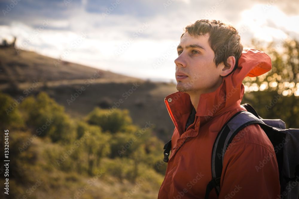 Fototapeta premium Man in mountain at sunset