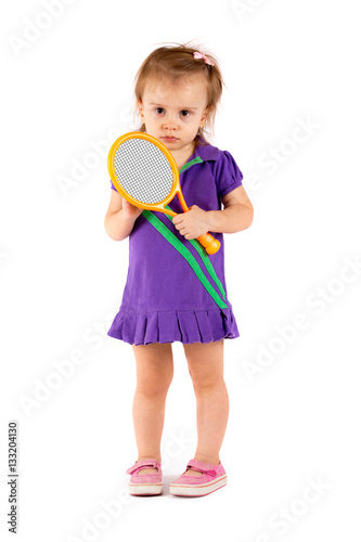 Little cute girl playing tennis on a white background © guardalex