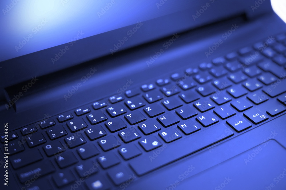 Computer keyboard with blue ligth - close up