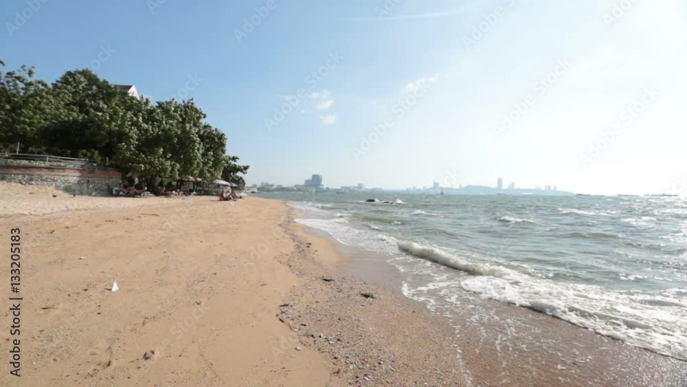 Riverside, ocean waves lapping on the sand beach Riverside, ocean waves lapping on the sand beach