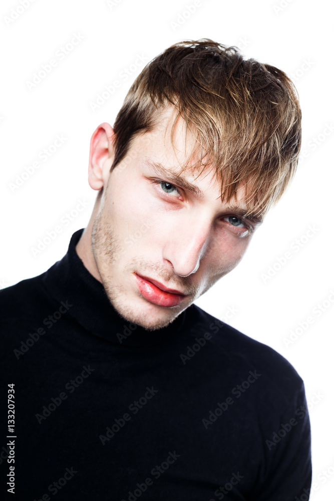 handsome young man in black jumper posing in studio handsome young man in black jumper posing in studio