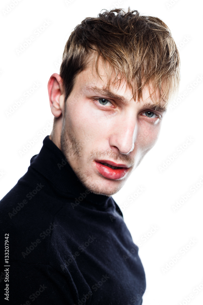 handsome young man in black jumper posing in studio handsome young man in black jumper posing in studio