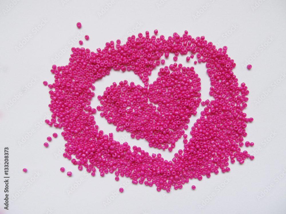 Heart from pink beads, a Valentine's Day card