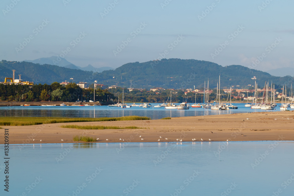 seascape. Bay with blue water on the background of the city of Hendaye ...