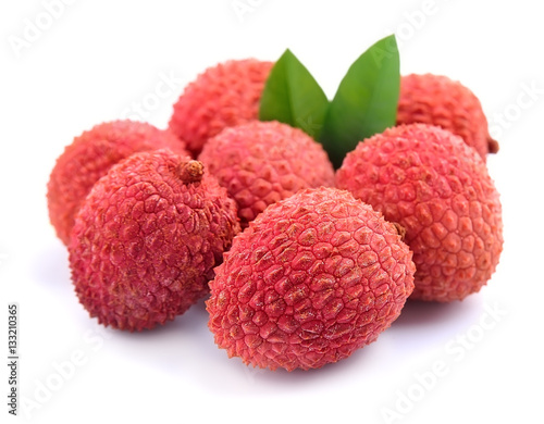 Sweet lychees fruits with leaves.