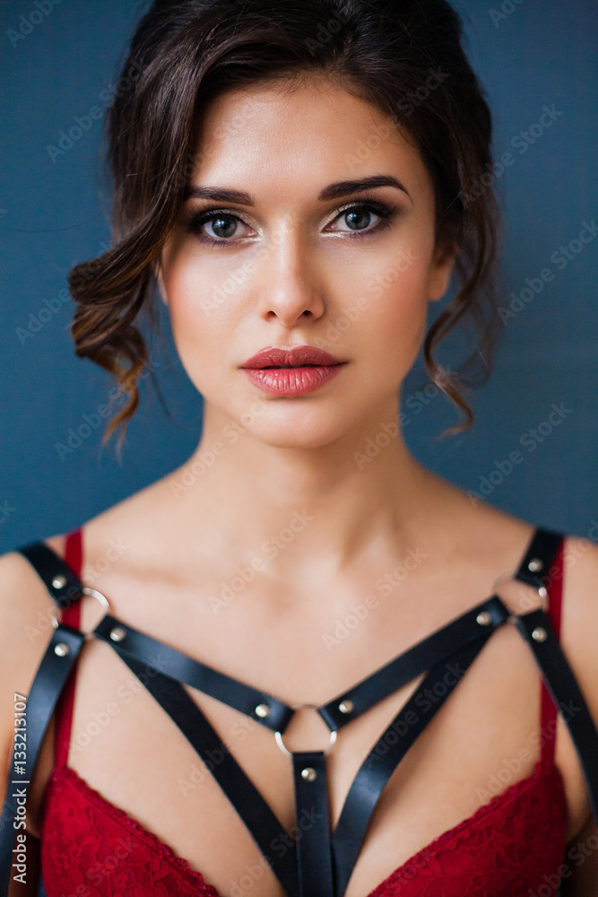 Portrait of Beautiful woman wearing seductive lingerie and leather accessories. Portrait of Beautiful woman wearing seductive lingerie and leather accessories.