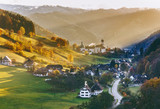 Colourful countryside landscape with mountain forests, traditional houses and old monastery. Germany, Black Forest. 