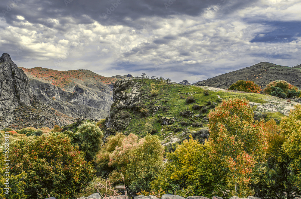Obraz premium Mountain landscape in autumn day &nbsp;and heavy, hurricane&nbsp;clouds in darkened sky