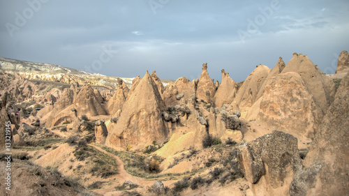 Cappadocia, Turkey - November 15, 2014: Panorama of unique geological formations in Cappadocia, Turkey. 
