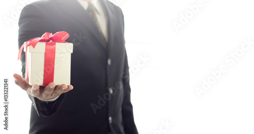 Businessman holding Gift box for bonus