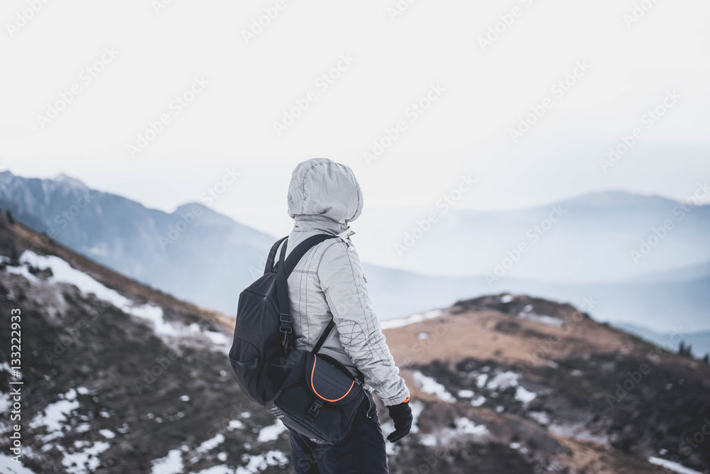 Man Traveler with backpack hiking Travel Lifestyle concept beautiful mountains landscape on background 