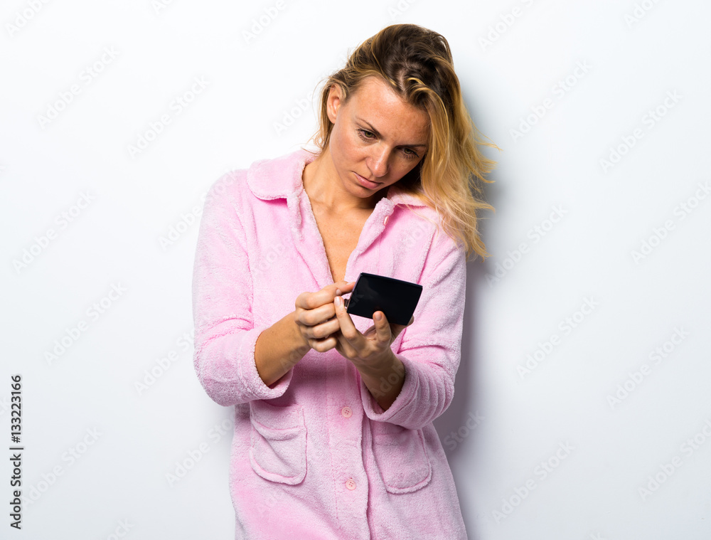 Beautiful girl in pink dressing gown in make-up Beautiful girl in pink dressing gown in make-up