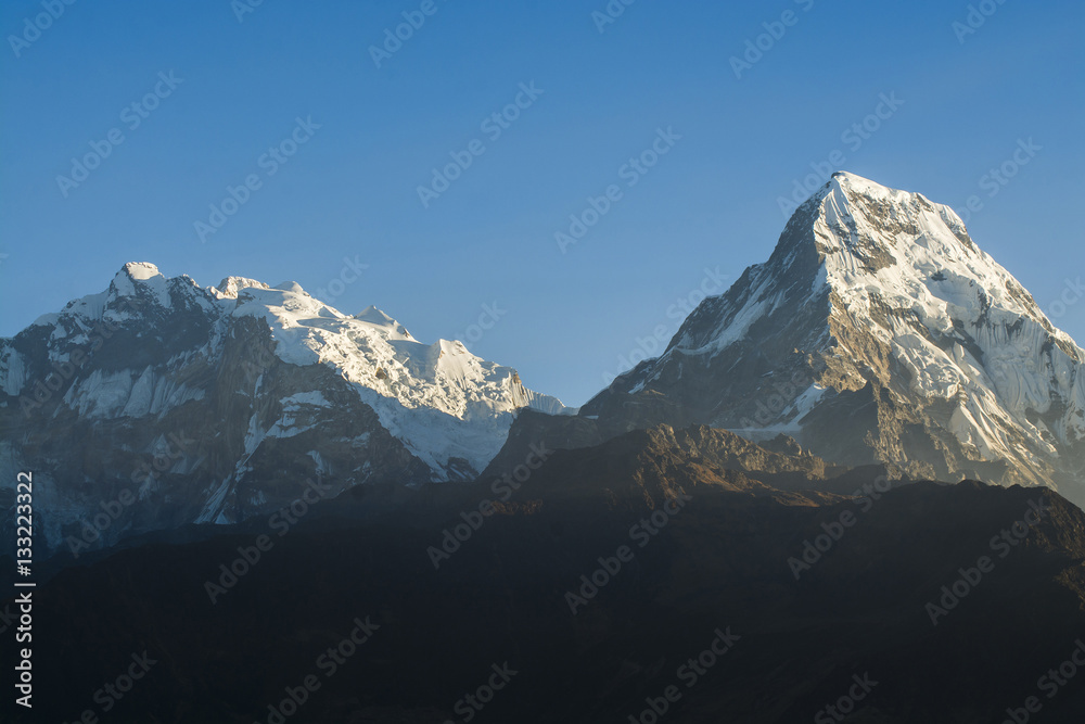 Mountain peaks with blue sky background in Nepal