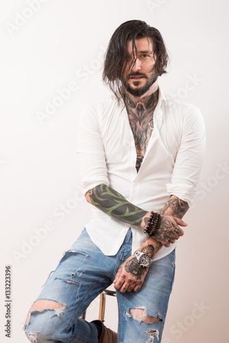 Wallpaper Mural Tattooed man with messy hair in casual clothes Torontodigital.ca