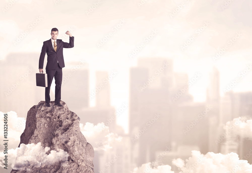 Confident businessman on dangerous cliff Confident businessman on dangerous cliff