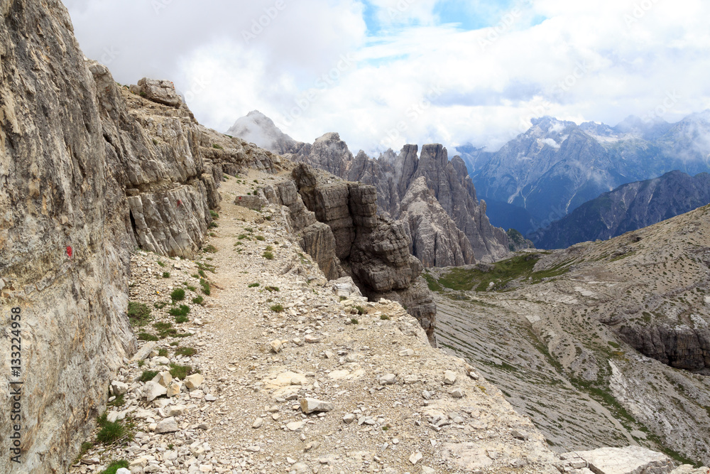 Footpath Alpinisteig and Sexten Dolomites mountain panorama in South Tyrol, Italy