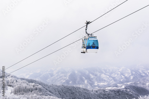 Gondola ski lift in mountains