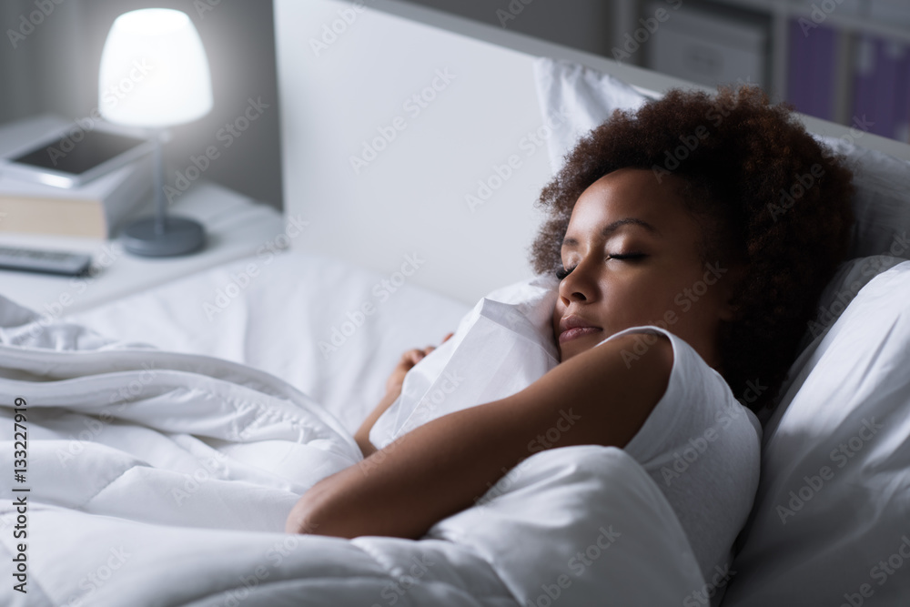 Woman sleeping in her bed - obrazy, fototapety, plakaty 