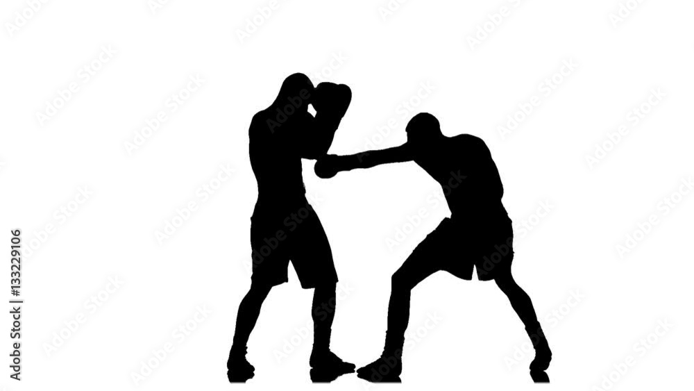 Athletes boxers sparring in the studio. Silhouette in slow motion Athletes boxers sparring in the studio. Silhouette in slow motion