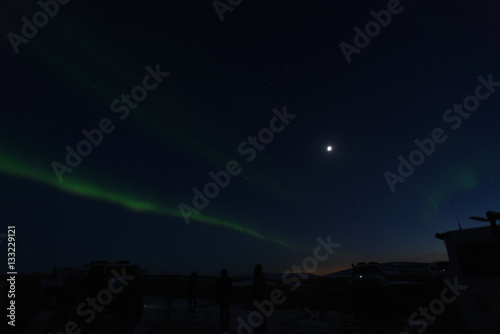 Northern lights in iceland with moon and jeep