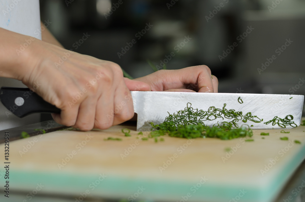 Chef training cut vegetable on cutting board with knife japan Chef training cut vegetable on cutting board with knife japan
