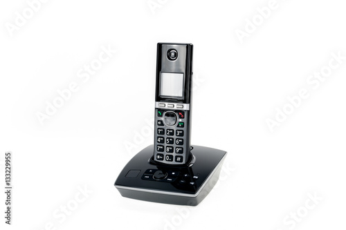 modern cordless dect phone with answering machine and charging station isolated on white background