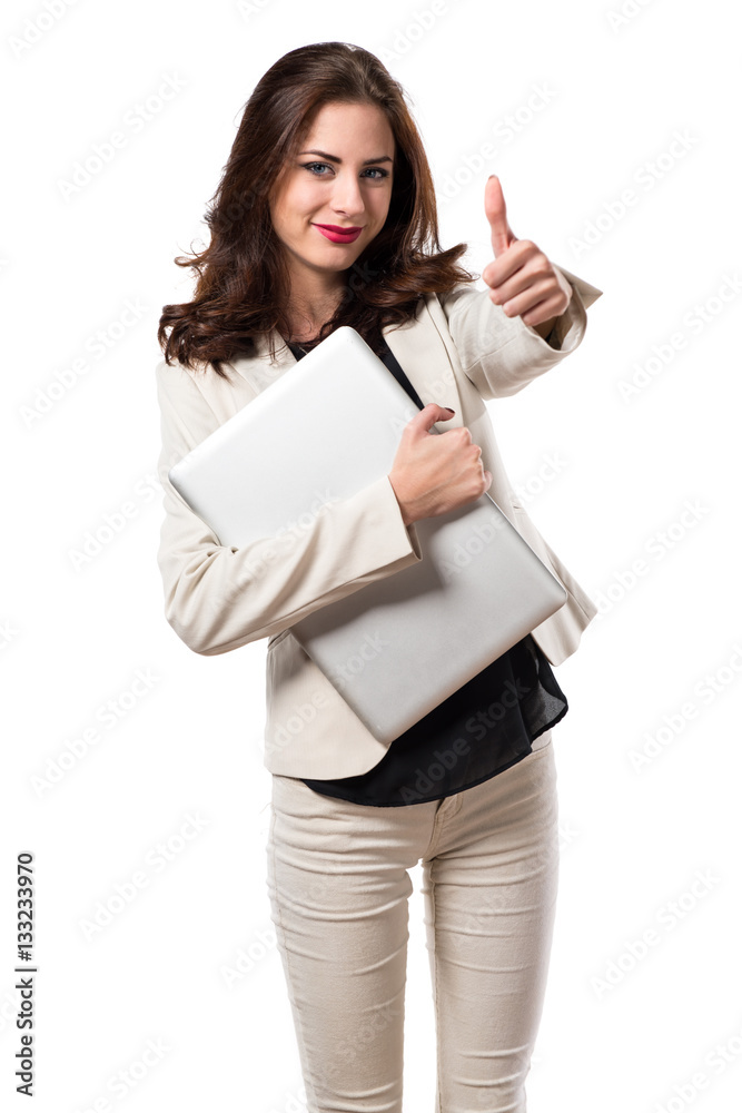 Pretty young business woman with laptop and with thumb up Pretty young business woman with laptop and with thumb up