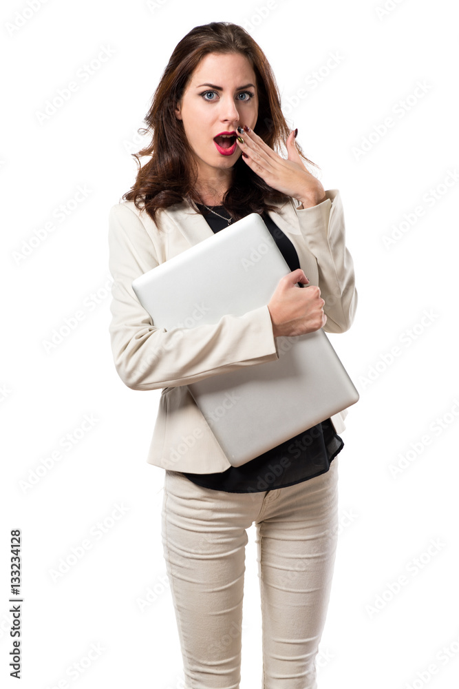Surprised pretty young business woman with laptop Surprised pretty young business woman with laptop