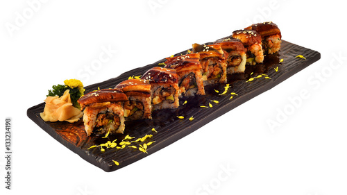 Unagi roll. Japanese eel sushi roll set on wooden ceramic plate  with white isolate background . traditional dinning of Japanese cuisine.