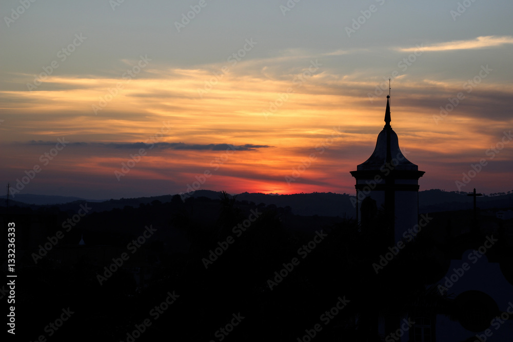 Setting sun with church tower