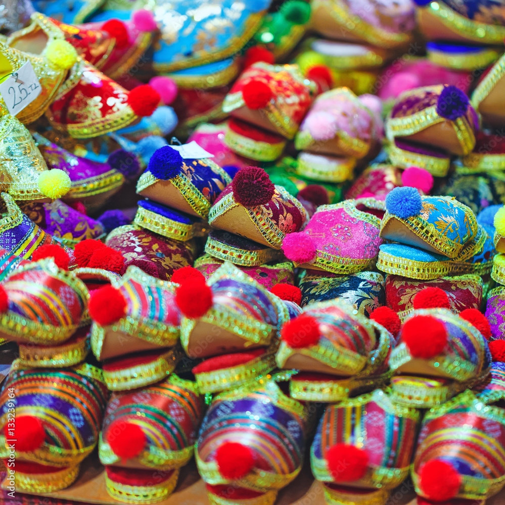 Pile of Turkish traditional shoes with pompon at grand bazaar in Istanbul, Turkey.