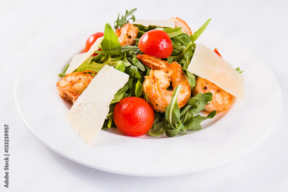 Caesar salad with tiger shrimps, parmesan and tomato Caesar salad with tiger shrimps, parmesan and tomato