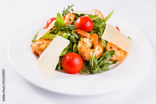 Caesar salad with tiger shrimps, parmesan and tomato 