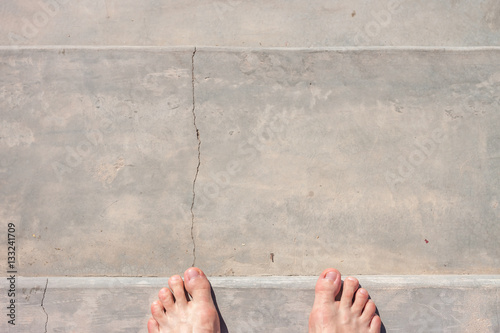barefoot on concrete surface