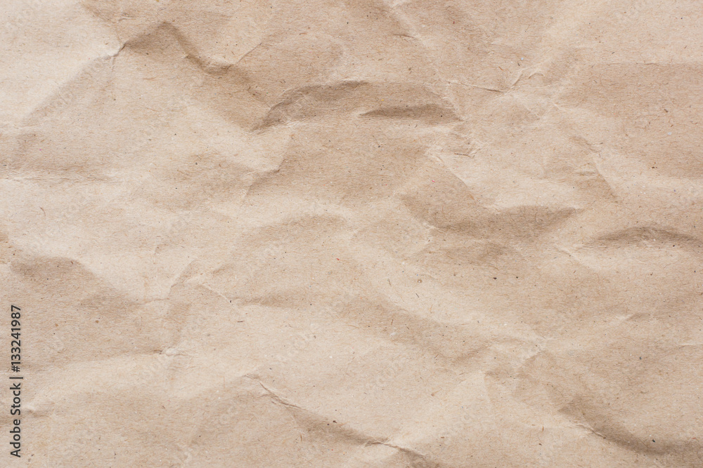 Recycled crumpled light brown paper texture or paper background Recycled crumpled light brown paper texture or paper background